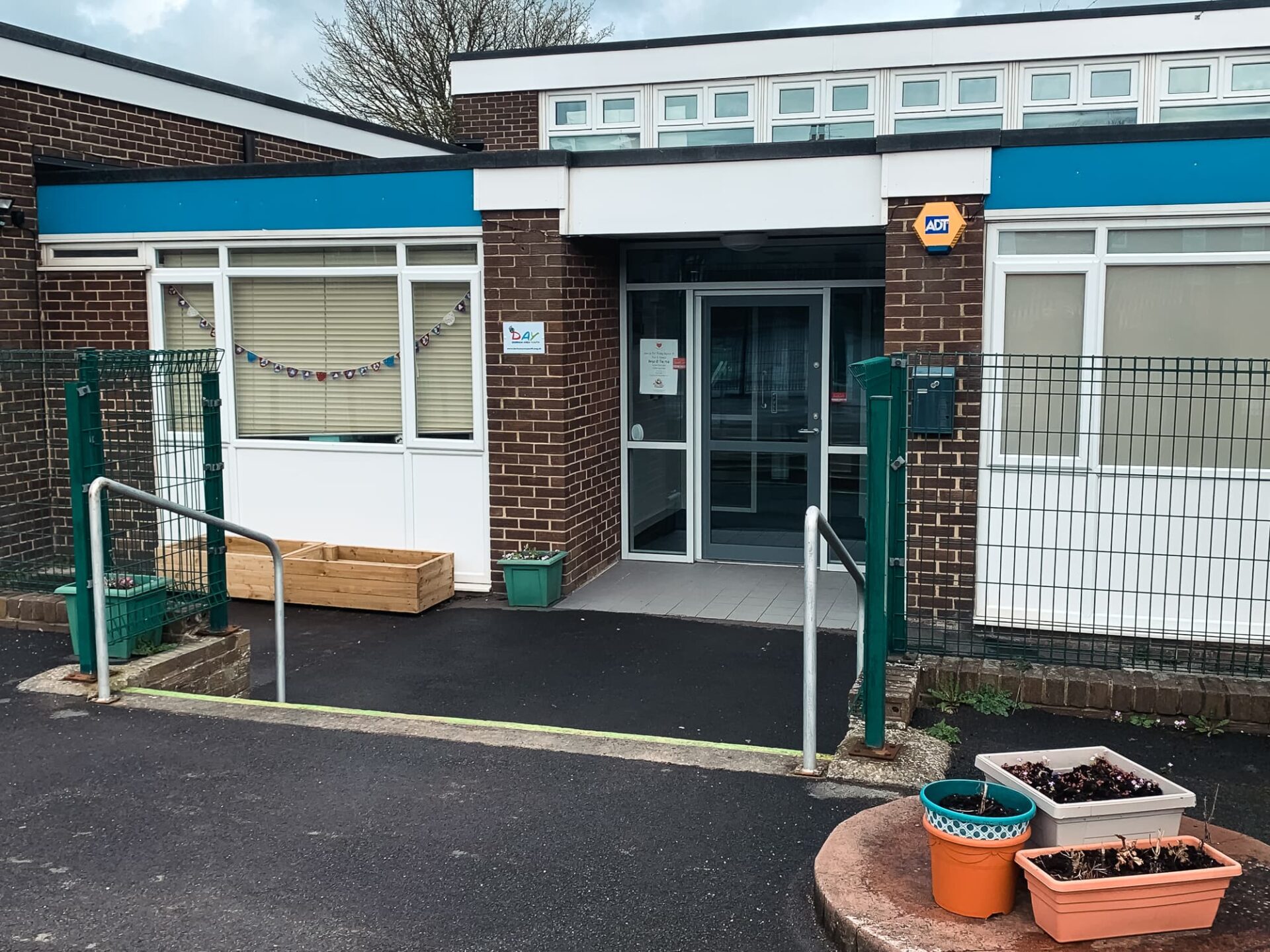 several planters around the main entrance to the Sherburn hill hub